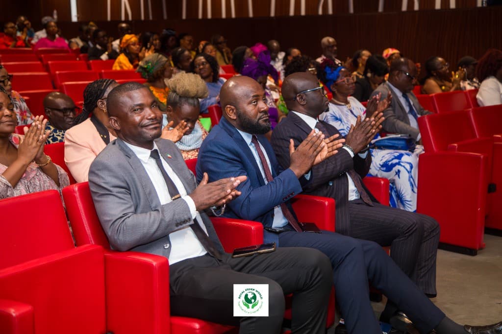 Delegates applauding from the red seats