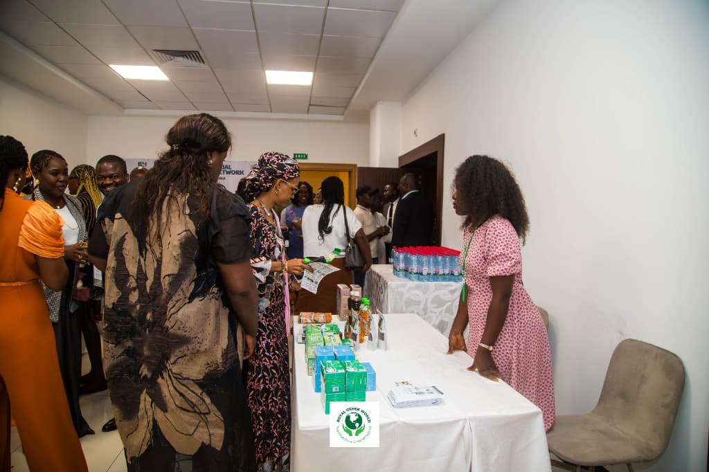 Visitors browsing packaged goods at an exhibition table
